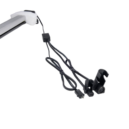 Black camera mount with power cable on a white background
