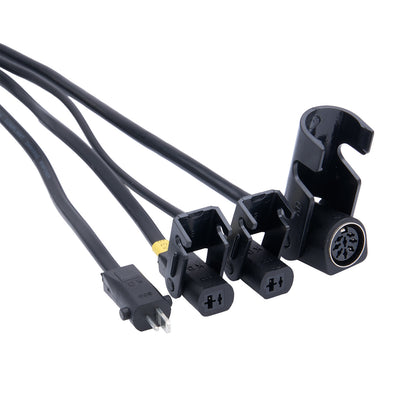 Set of black electrical connectors with wires on a white background