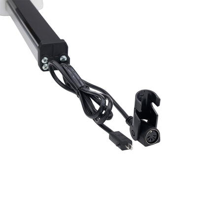 Black electronic control module with attached power cable and connector, shown on a plain white background.