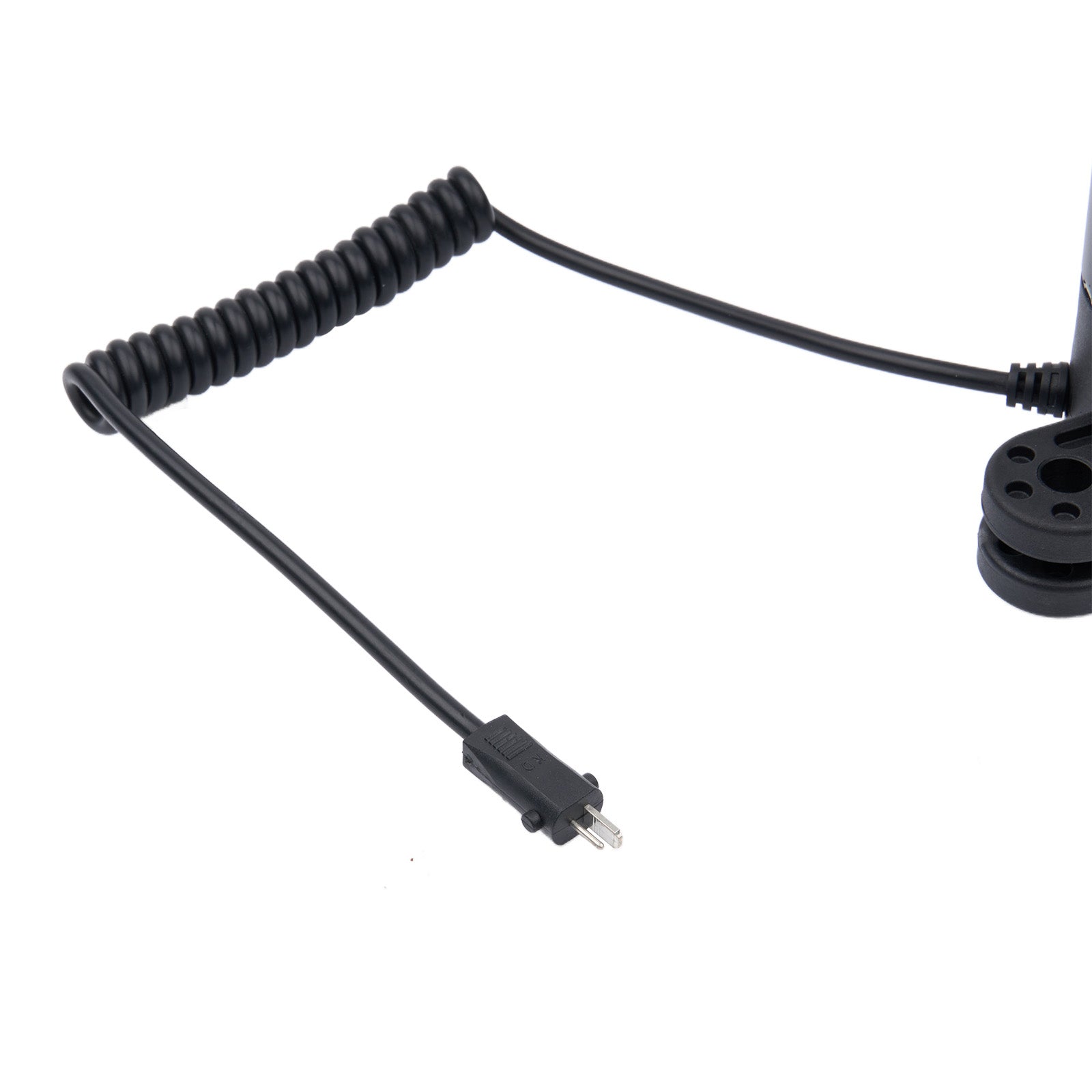 Black coiled cable with a connector on a white background