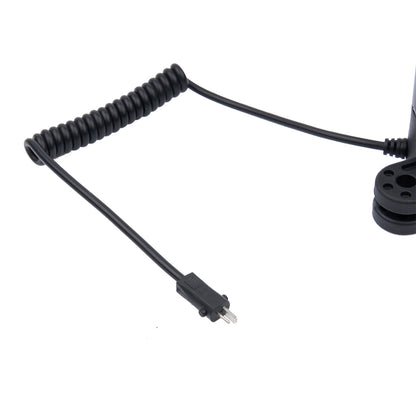 Black coiled cable with a connector on a white background
