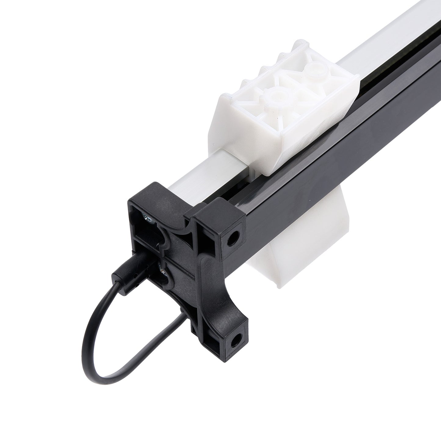 Close-up of a mechanical component with a white gear and black and gray metal parts on a white background.