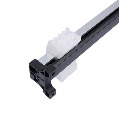 Close-up of a black and white plastic component on a white background