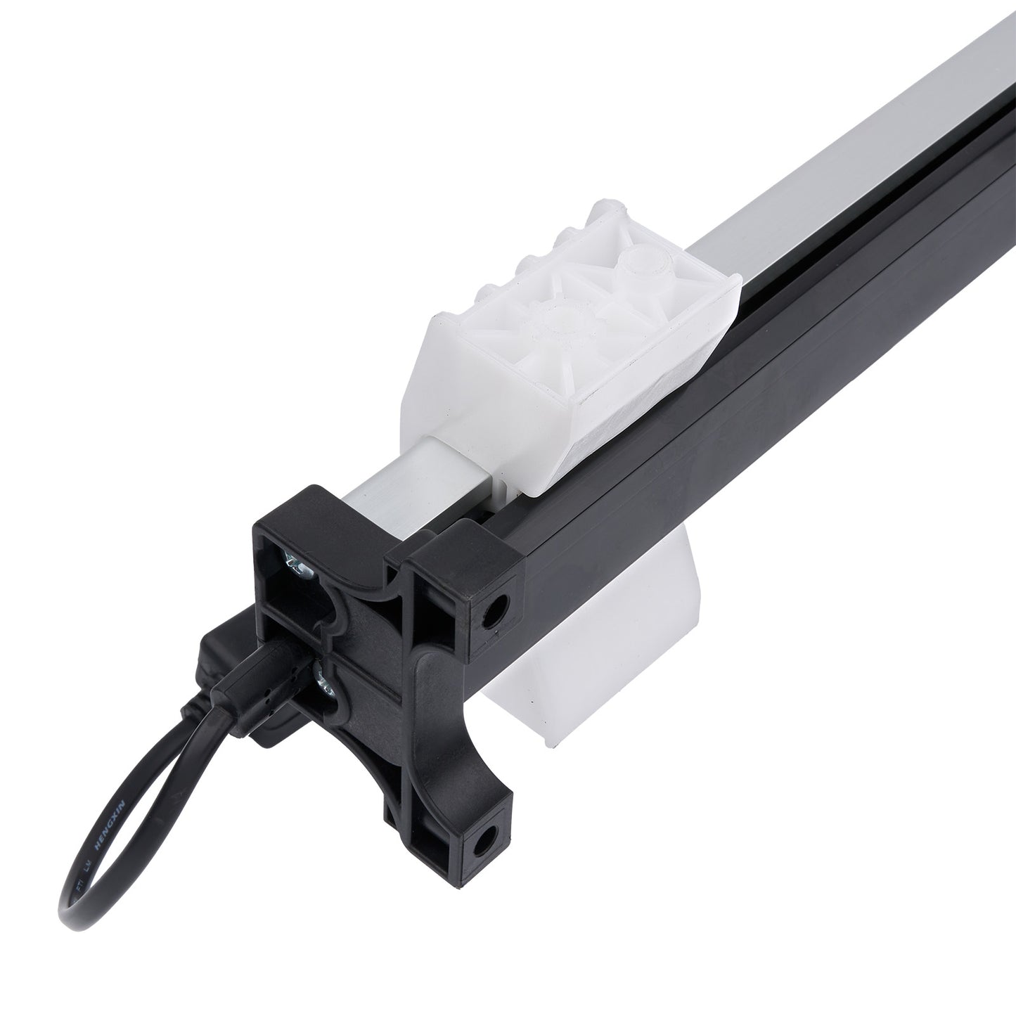 Close-up of a mechanical component with a white gear and black housing on a white background