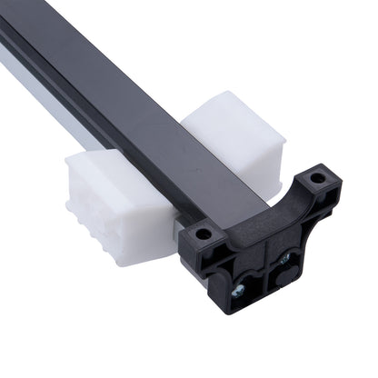 Close-up of a metal rod with black plastic connectors on a white background