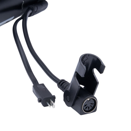 Black electronic device with cable on a white background