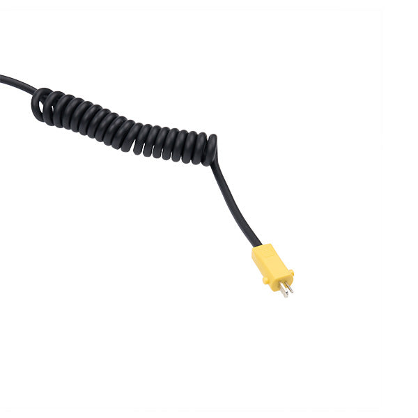 Coiled black cable with a yellow plug on a white background