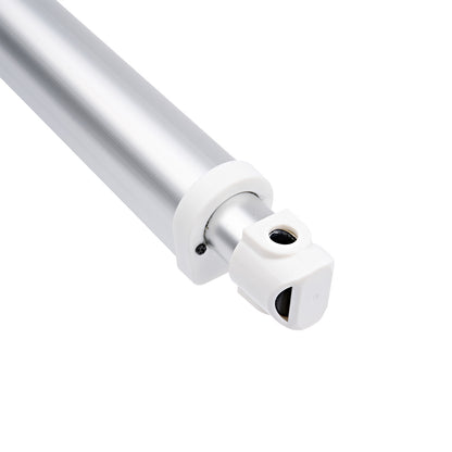 Close-up of a metallic rod with a white base on a white background