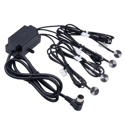 Black electronic component with multiple cables on a white background