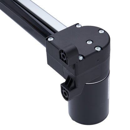 Black mechanical component with metallic rod on a white background