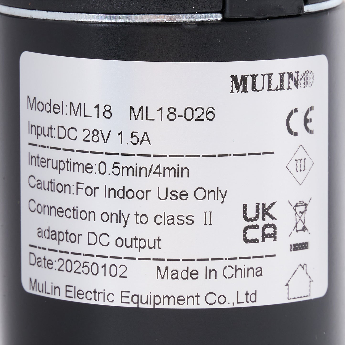 Label on a black cylindrical device with technical specifications and branding.