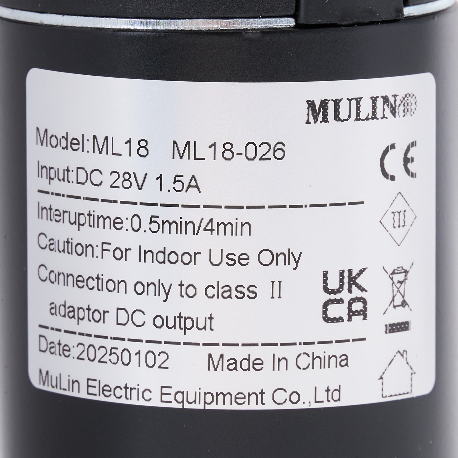 Label on a black cylindrical device with technical specifications and branding.