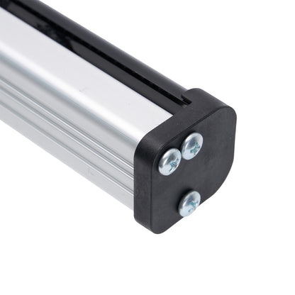 Close-up of a metal rod with black end cap and screws on a white background