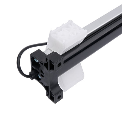 Close-up of a mechanical arm with a white object on a white background