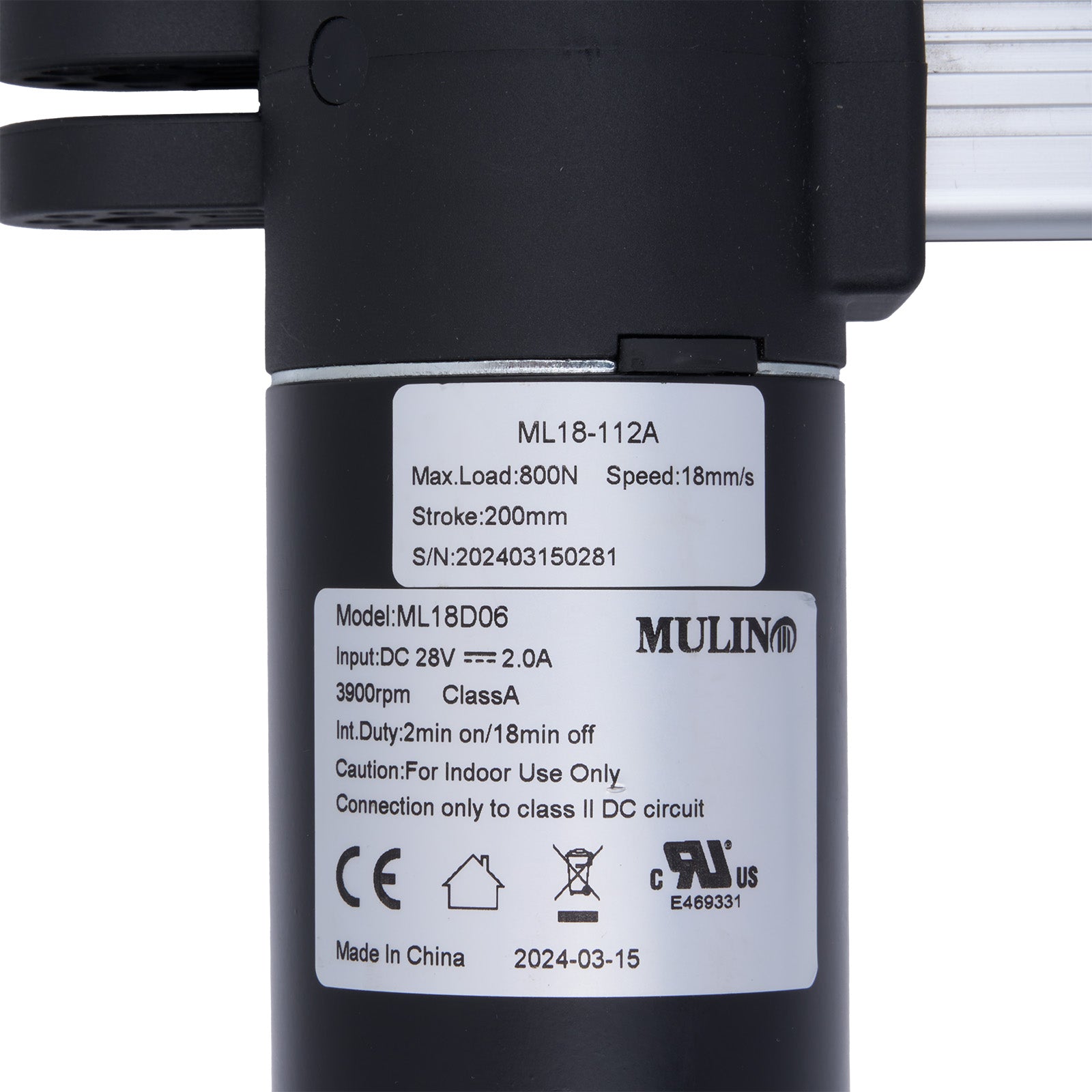 Black actuator with technical specifications label on a white background