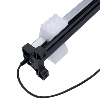 Light fixture with black housing and white diffuser on a white background