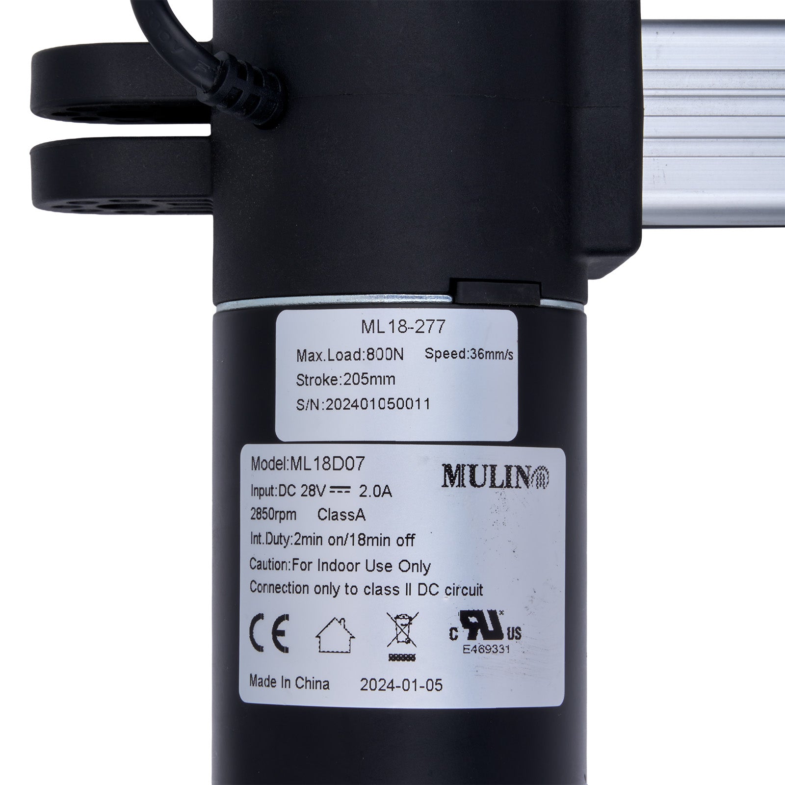 Black actuator with technical specifications label on a white background