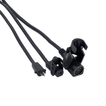 Black electrical cables with connectors on a white background