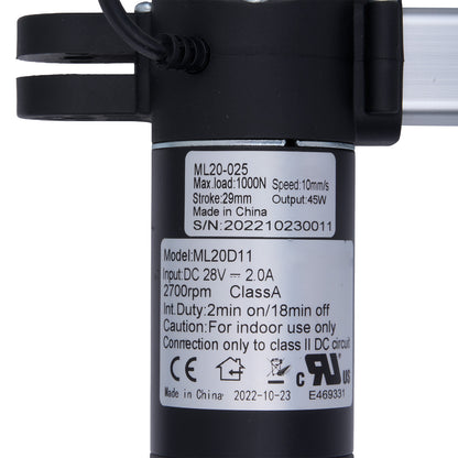 Black mechanical component with technical specifications label on a white background