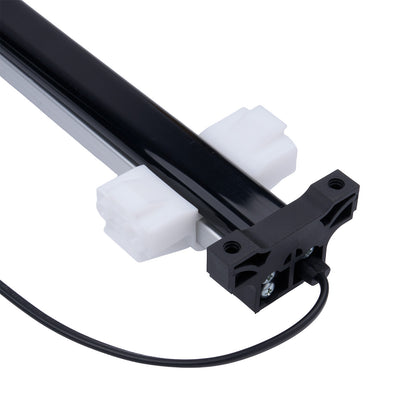 Mechanical component with black rod, white cylindrical parts, and a black housing on a white background