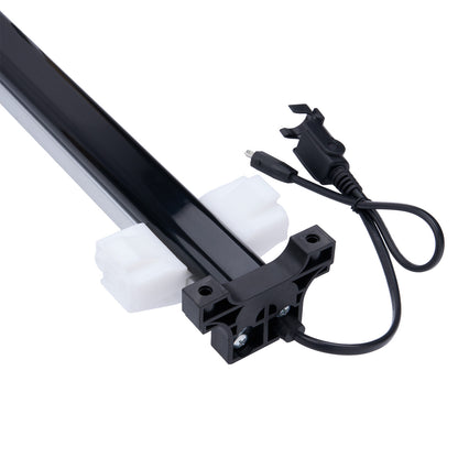 Light fixture with black housing, white diffuser, and power cord on a white background