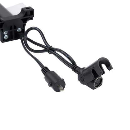 Black electronic component with cable on a white background