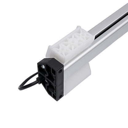 Mechanical component with a white plastic block and black electrical connector on a white background