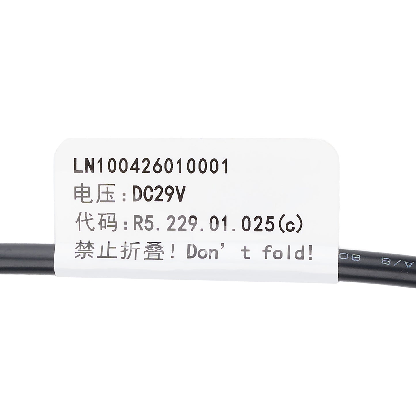 A close-up of a black cable with a white label printed with product code LN100426010001, DC29V voltage, and a 'Don't fold!' warning in Chinese and English.