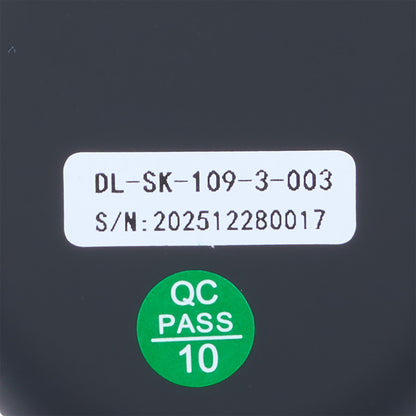 Product label with serial number and 'QC Pass' sticker on a dark background