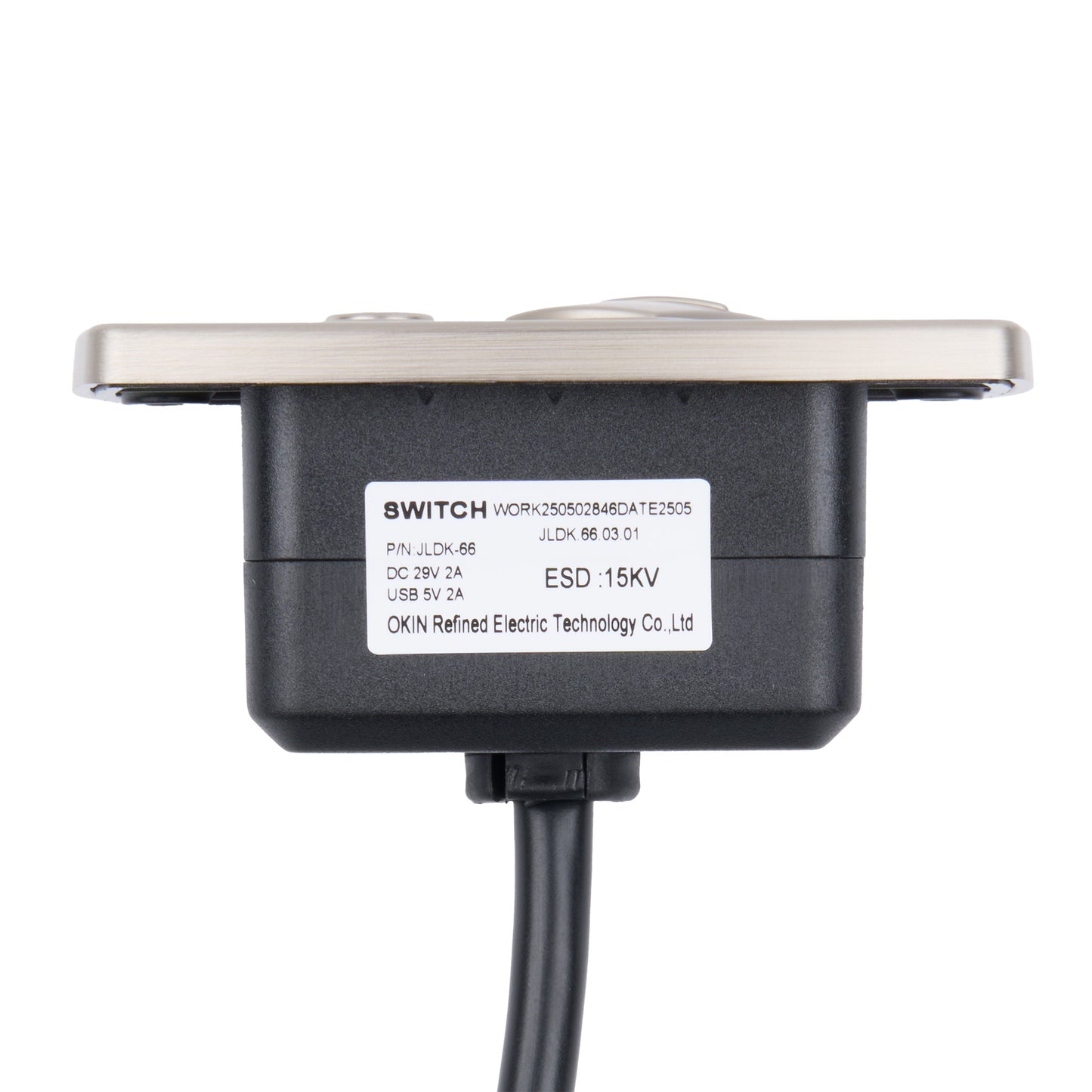 A black electronic switch module with a silver metal mounting plate and a black cable, featuring a white label with product specifications.