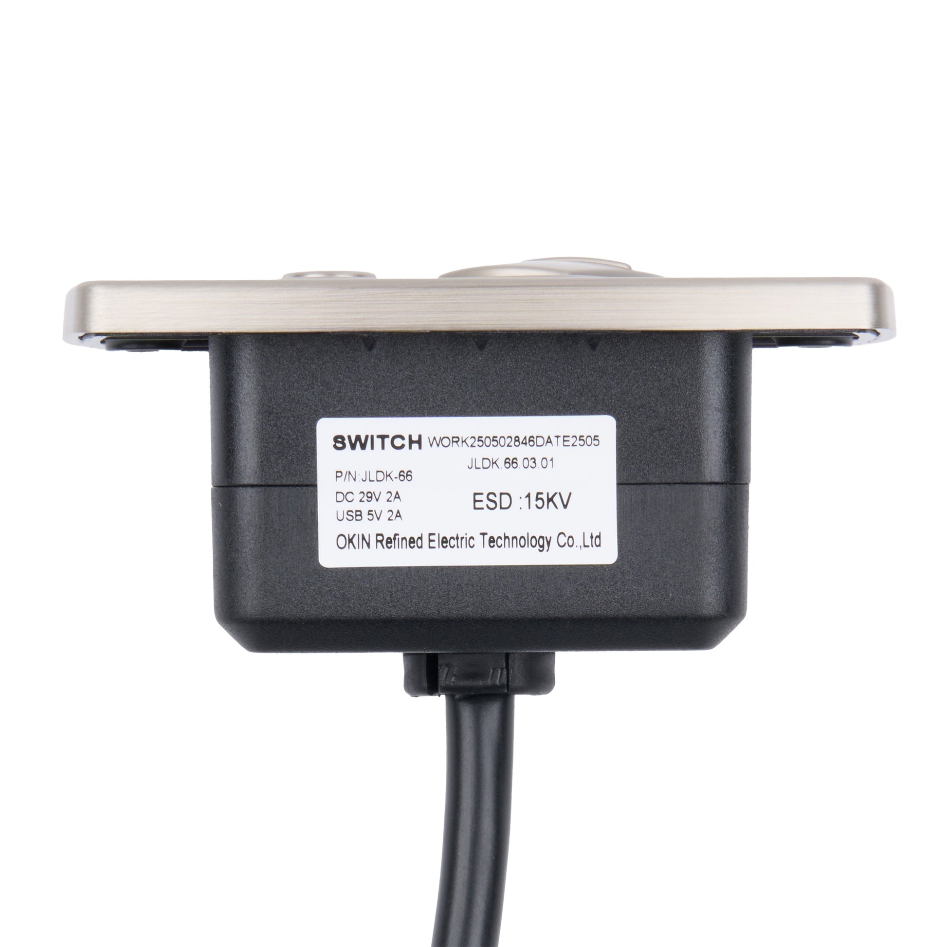 A black electronic switch module with a silver metal mounting plate and a black cable, featuring a white label with product specifications.