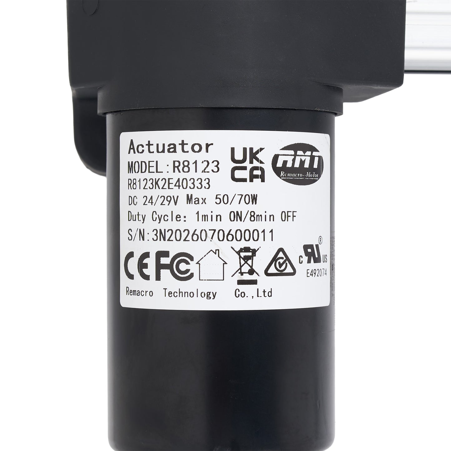 A close-up of a black cylindrical electric actuator with a white product specification label showing the model UKCA R8123 and brand ATI.