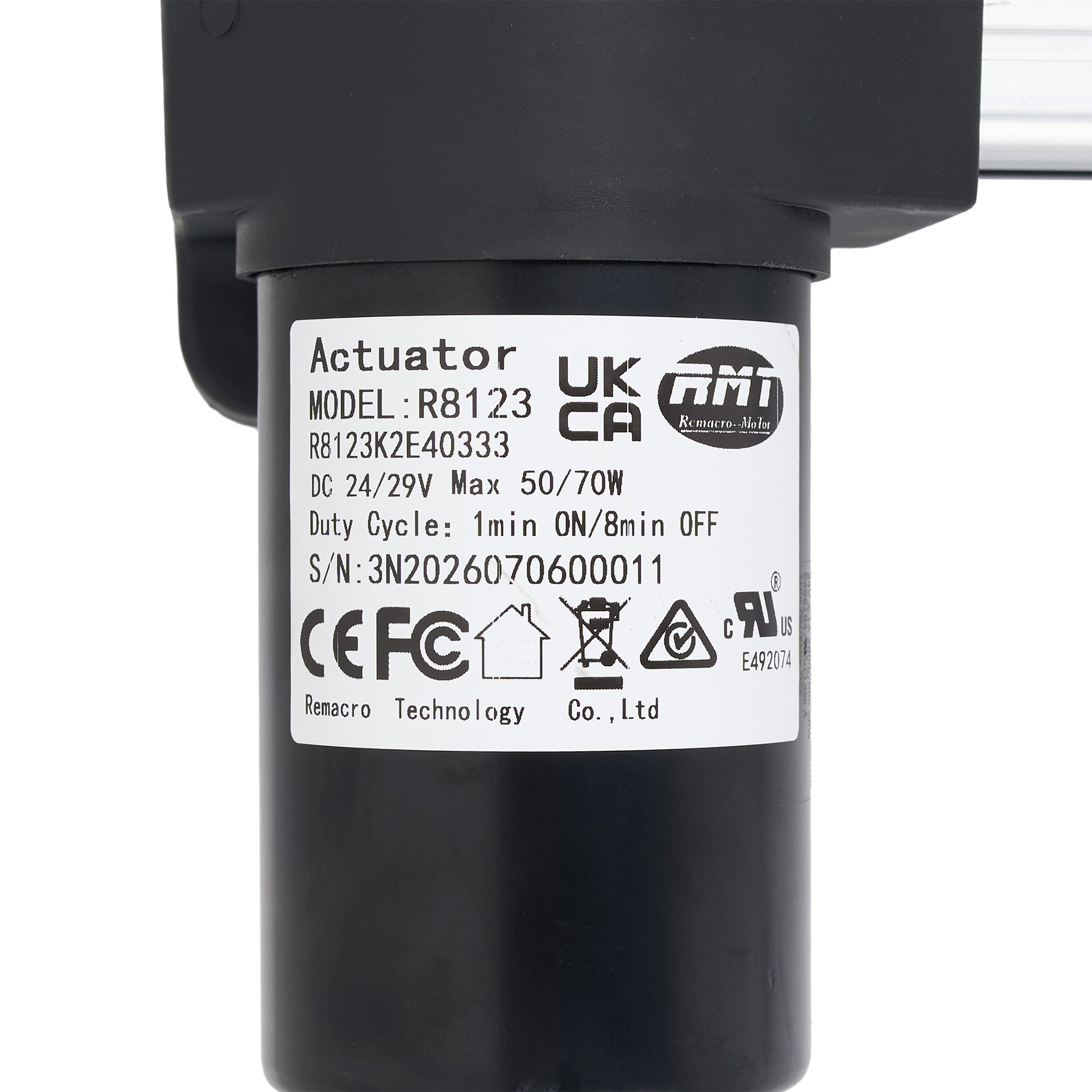 A close-up of a black cylindrical electric actuator with a white product specification label showing the model UKCA R8123 and brand ATI.