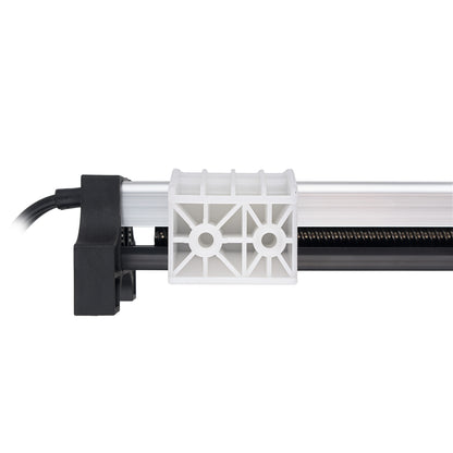 A close-up of a linear rail system with a black mounting bracket, a white plastic connector block, and a black rail on a white background.