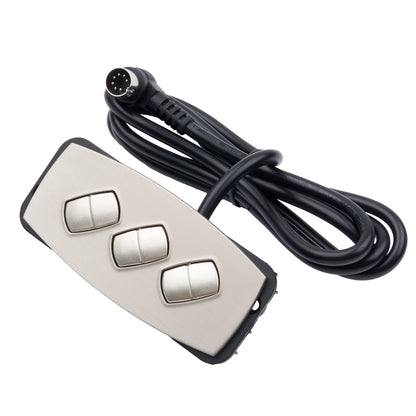 Control panel with three silver buttons and a black cable on a white background