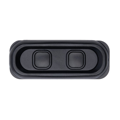 Black rectangular object with two circular cutouts on a white background
