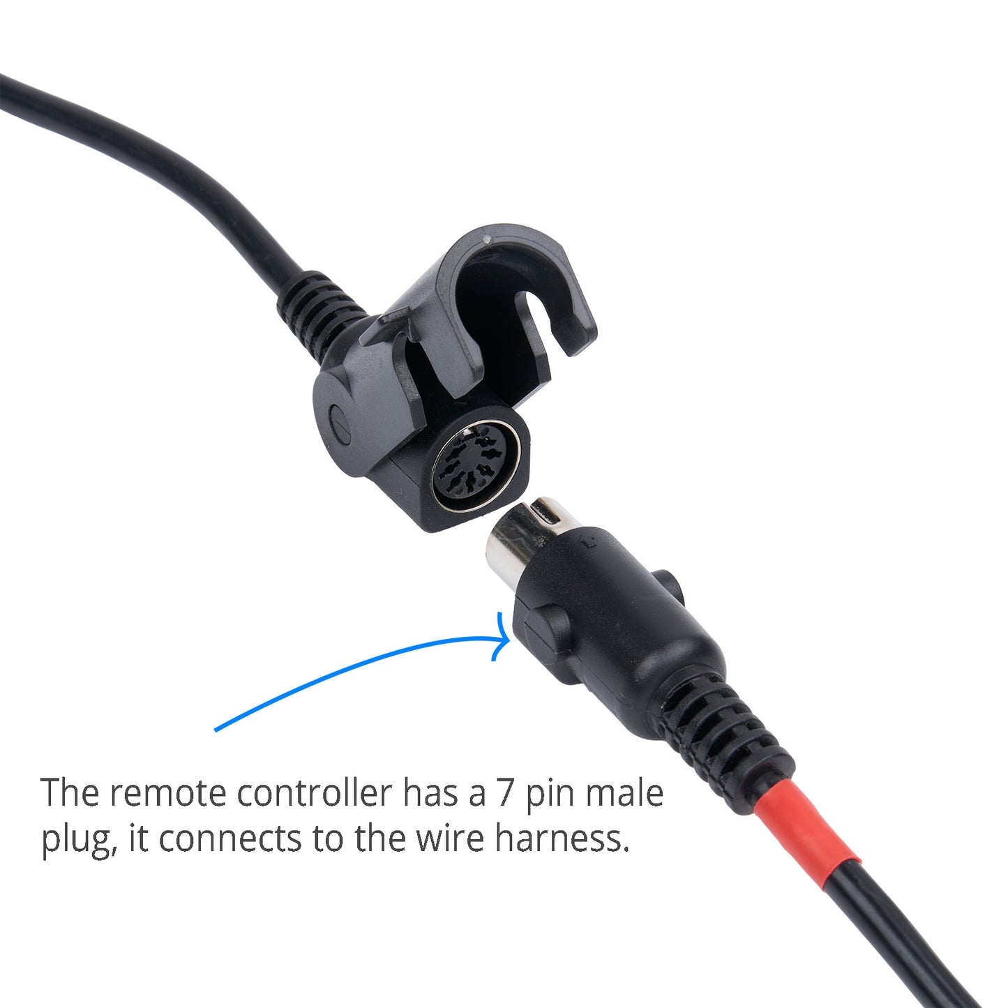 Close-up of a remote controller with a 7 pin male plug connector on a white background.