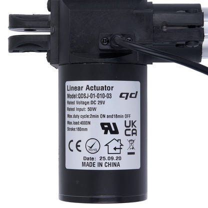 Black linear actuator with label on a white background