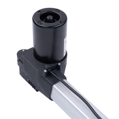 Black cylindrical component with a metallic arm on a white background