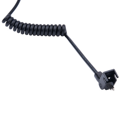 Black coiled cable with a connector on a white background