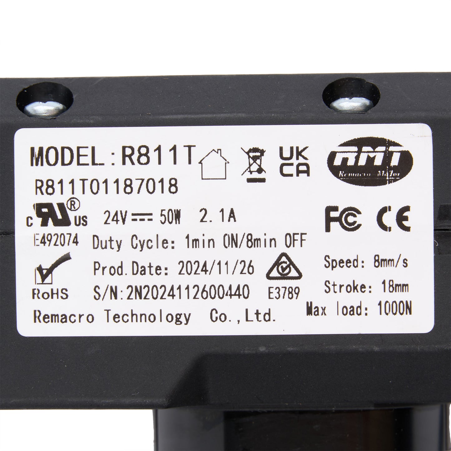 Technical label on a black mechanical component with model details and certification logos.
