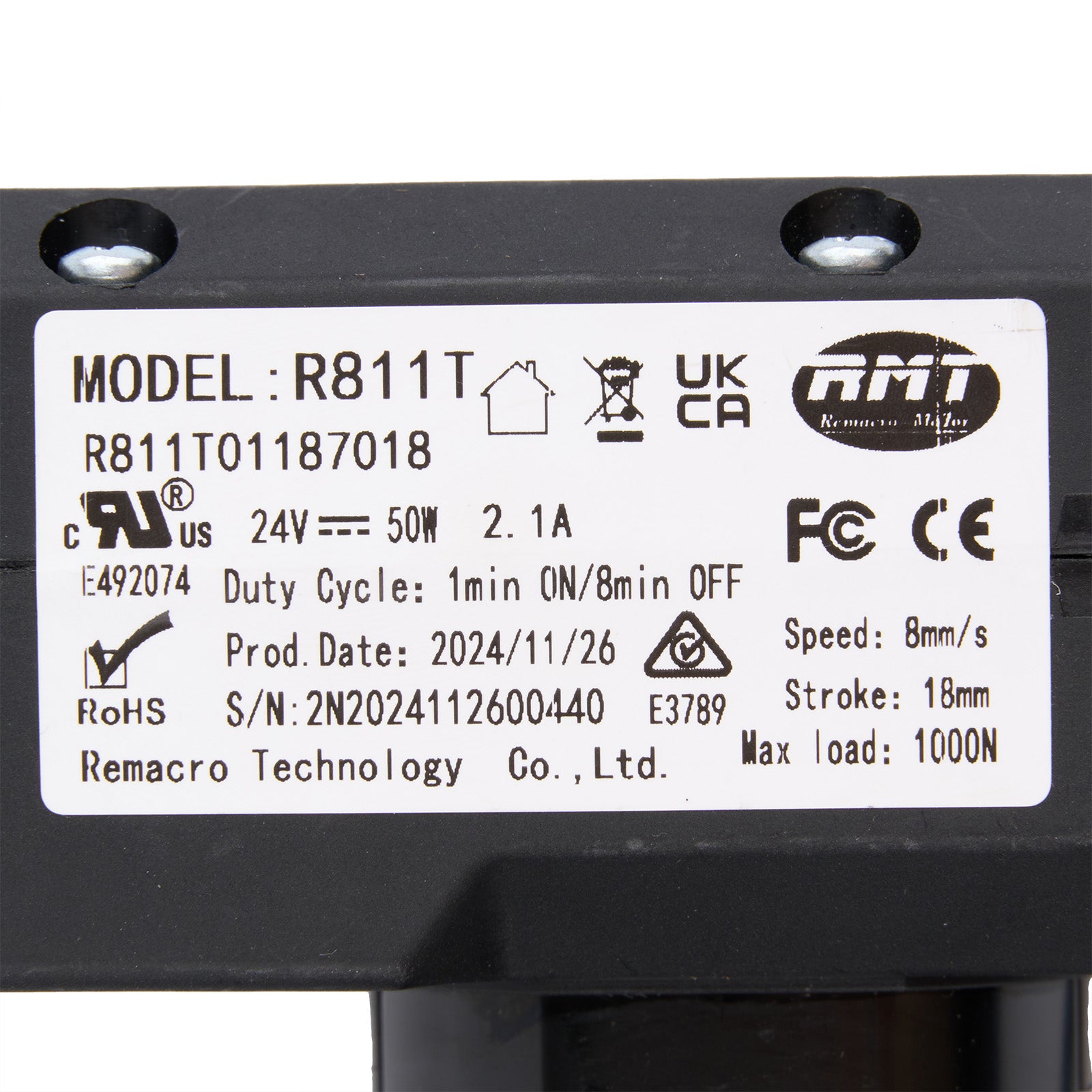 Technical label on a black mechanical component with model details and certification logos.