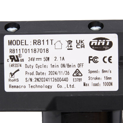 Technical label on a black mechanical component with model details and certification logos.