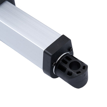 Close-up of a cylindrical metal component with a black connector on a white background.