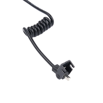 Black coiled cable with a plug on a white background