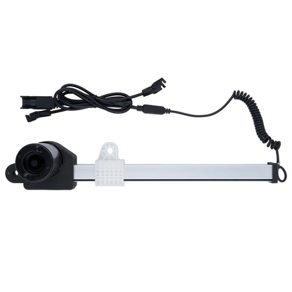 Electronic component with black housing and coiled cable on a white background