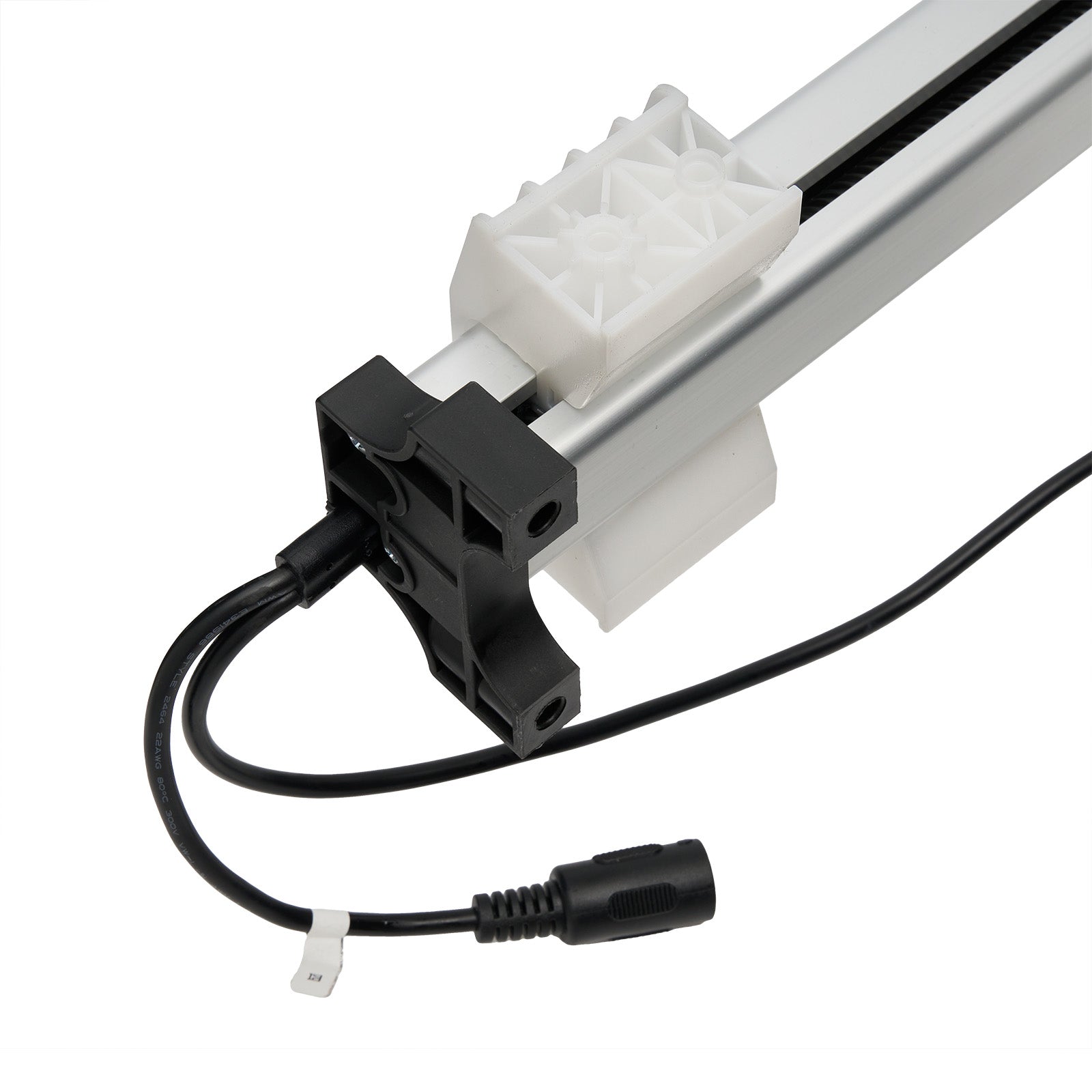 Close-up of a mechanical component with a white gear and black wiring on a white background.