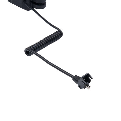 Black coiled cable with a plug on a white background