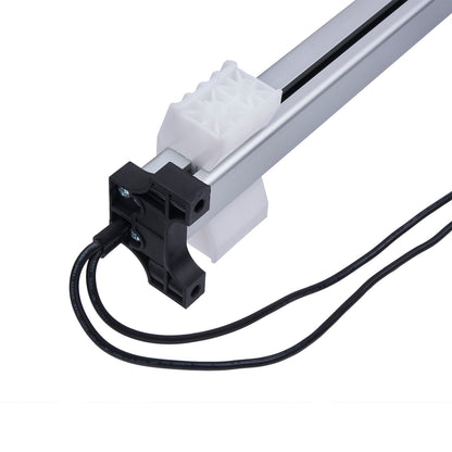 Mechanical component with black cable on a white background