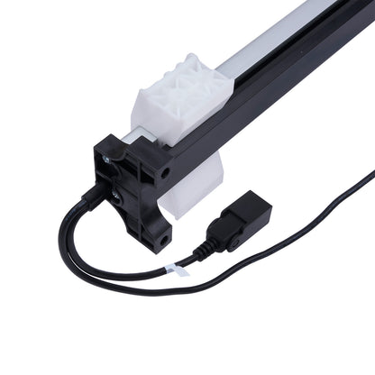 Light fixture with black cable and white connector on a white background